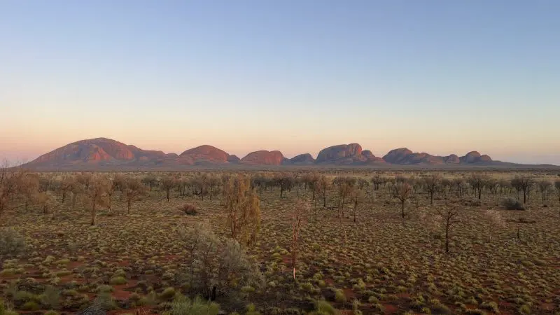 a distant view of the olgas in the Red Centre