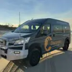 a black van parked on a beach