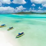 Three boats at whitehaven beach