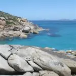 Stunning rocky coastline with massive boulders and vibrant turquoise waters on the 1 Day Wilsons Promontory Tour by Go West Tours.