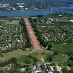 Stunning aerial view of Anzac Parade in Canberra, ideal for a Canberra day trip from Sydney, leading directly to Lake Burley Griffin.