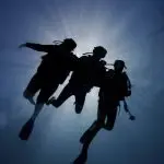 three divers in the ocean