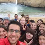 A happy group of friends snaps a selfie during their 1 Day Great Ocean Road and 12 Apostles Tour with Go West Tours in Australia.