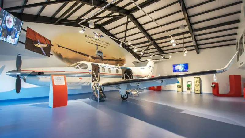 A Croc N History Explorer exhibit displays a vintage aeroplane indoors, surrounded by engaging aviation decor and informative signage.