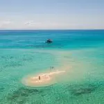 Small island with white sand in the ocean at Great Barrier Reef