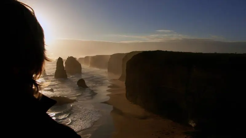 Experience the breathtaking sunset views over rugged ocean cliffs on a 1 Day Great Ocean Road Sunset Tour with Go West Tours.