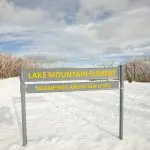 Sign at Lake Mountain Summit, 1,433m elevation, featured on the top-rated 1 Day Snow & Waterfalls Tour from Melbourne.