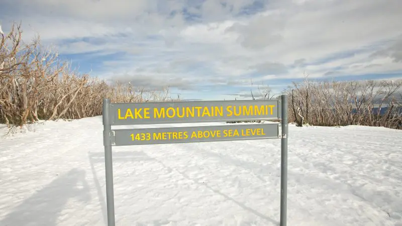 Sign at Lake Mountain Summit, 1,433m elevation, featured on the top-rated 1 Day Snow & Waterfalls Tour from Melbourne.