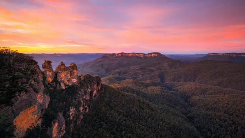 Discover breathtaking rock formations and lush forested hills on a premium 1-Day Blue Mountains Wilderness Tour with sunrise views.