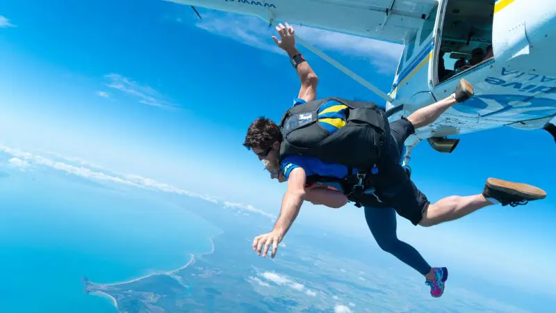 Experience the thrill of a 15,000ft tandem skydive over Mission Beach, soaring above pristine coastline and vibrant blue skies.