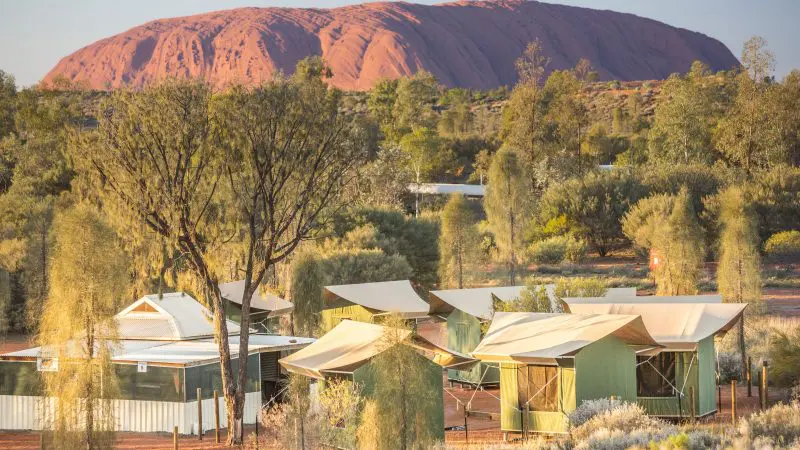 Luxury safari tents and lodges in the striking desert near Uluru, featured on the top-rated 2 Day Uluru Kata Tjuta Rock Tour.