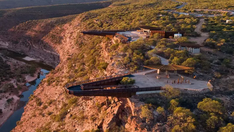 Stunning aerial view from Perth lookout on the 4-Day Perth to Monkey Mia Coastal Loop Tour, showcasing river and dramatic rugged landscape.