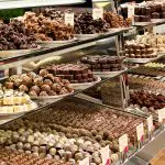 Showcase of premium assorted chocolates, a tempting highlight on your Lake Mountain Snow Waterfalls Tour from Melbourne.