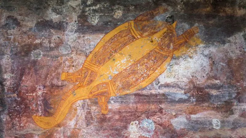 Stunning Aboriginal rock art featuring a yellow turtle, ideal for your Kakadu 4WD adventure in June or September.