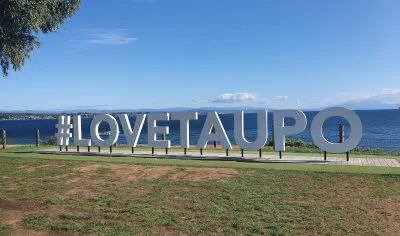 A prominent white sign features comprehensive, crucial information in bold text, ensuring all key details are easily accessible and visible.