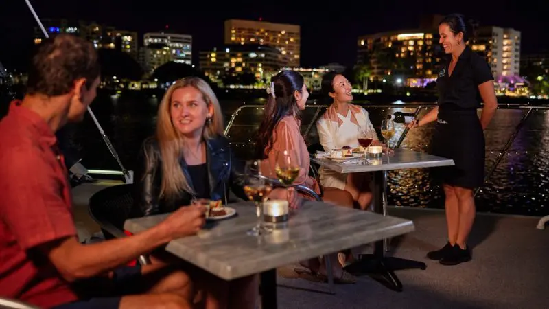 People dining on a harbour cruise on the Spirit of Cairns