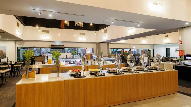 Elegant modern buffet arrangement in a spacious dining area, ideal for guests enjoying the 4 Day Kakadu Katherine Gorge Experience from Darwin.
