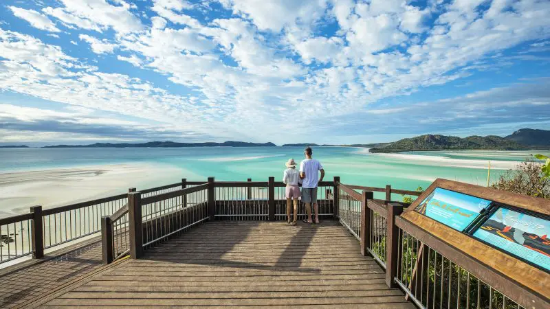 Couple looking out to view at whitehaven beach
