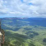 Breathtaking panoramic view of lush Blue Mountains forest, scenic waterfall walk, and vibrant social lunch on a top-rated day tour.