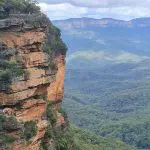 Stunning cliffside trail with panoramic Blue Mountains valley views, scenic waterfall walk, and a delightful social lunch on your day tour.