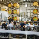 Travellers savour premium wine tastings on a 1 Day Hunter Valley Wineries Tour departing Sydney with Colourful Collective Travel.