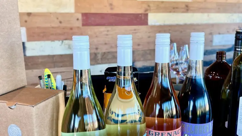 Four Haselgrove Wines bottles elegantly displayed—ideal for an unforgettable coastal wine tasting tour or weekend getaway experience.