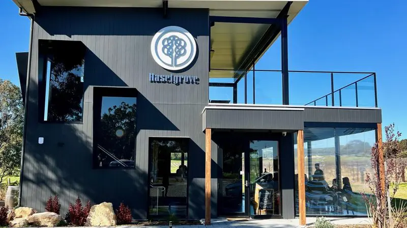 Sleek two-storey black building with expansive windows, perfect for a coastal afternoon wine tasting tour or 1-2 day getaway.