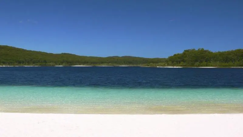 Pristine white sand beach and crystal-clear turquoise waters featured on The Great Escape Australia 28 Day Semi-Guided adventure tour.