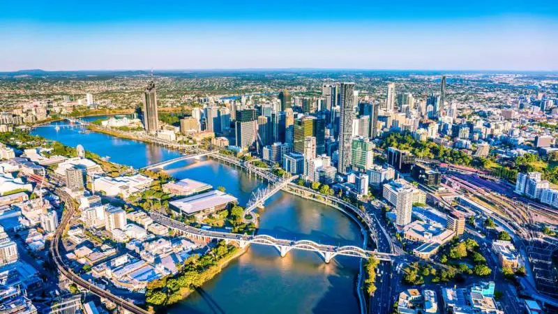 Stunning aerial view of city skyline, winding rivers, and iconic bridges during The Great Escape Australia 28 Day Semi-Guided Adventure.