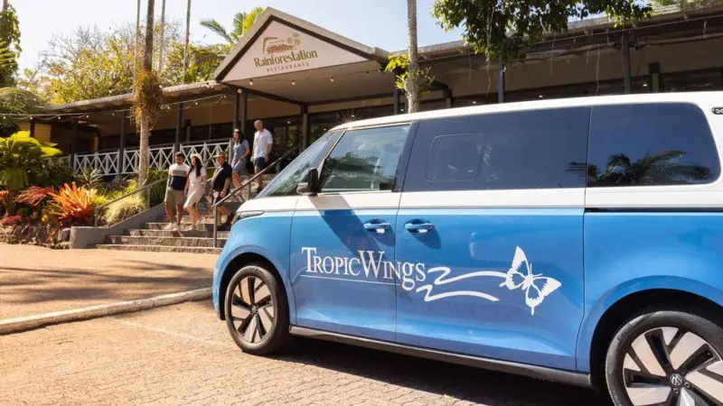 Blue Tropic Wings van parked at Rainforestation Nature Park, ready for a Private Exclusive Grand Kuranda tour in Cairns, Australia.