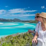 A couple admires stunning coastal scenery on the 16 Day Best of East Coast Australia Comfort Tour departing from Sydney.