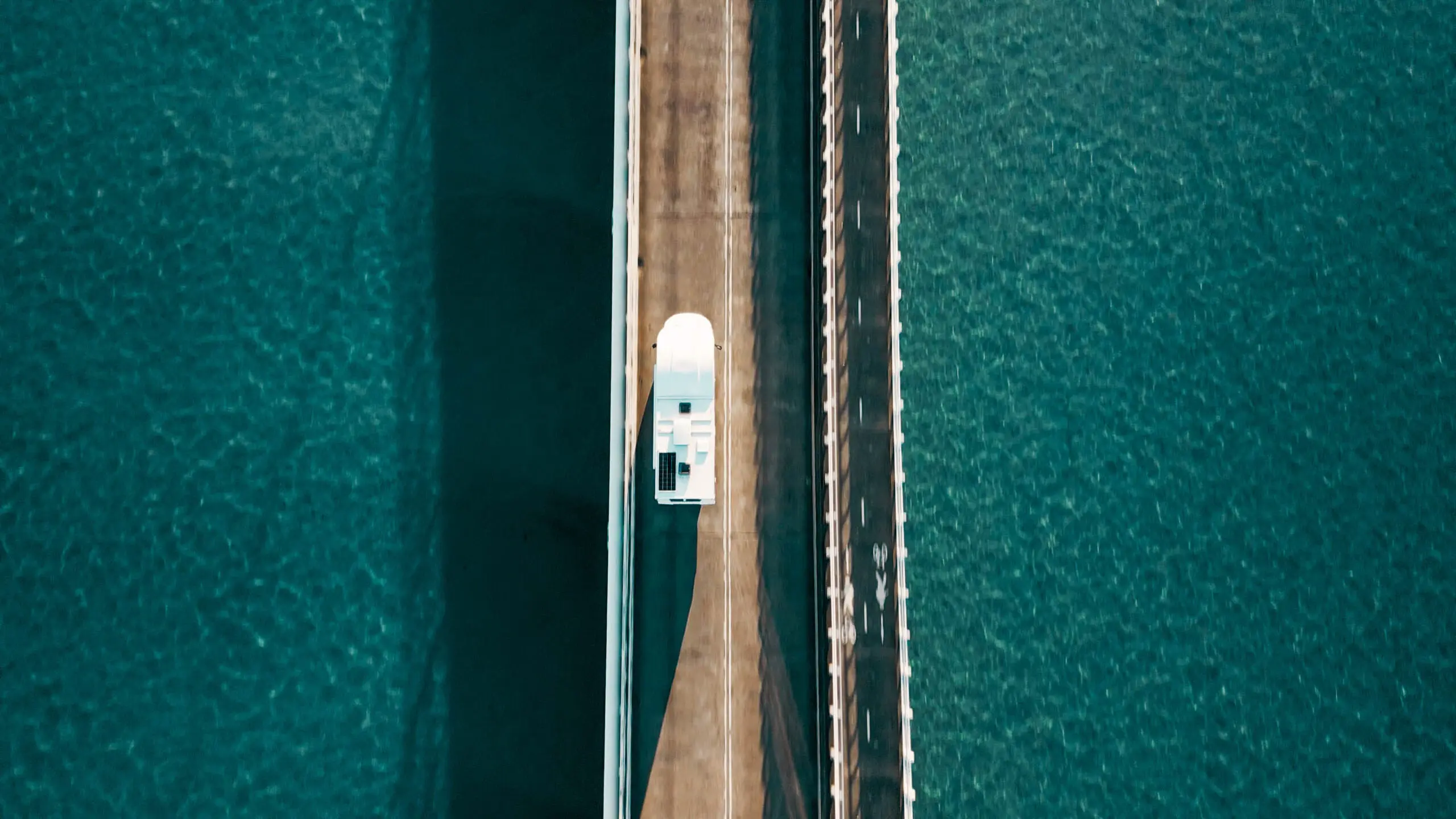 Apollo Euro Deluxe driving on bridge birds eye view