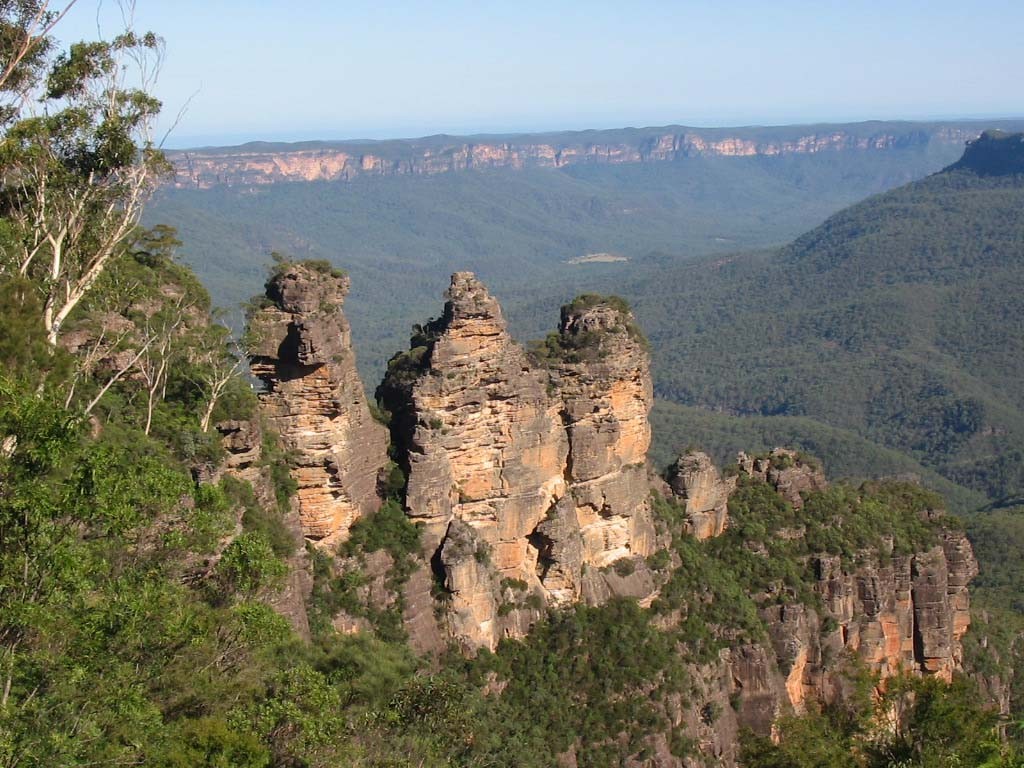 Iconic Three Sisters rock formation in Blue Mountains, seen on a 1-day guided wildlife park tour through lush forested mountains.
