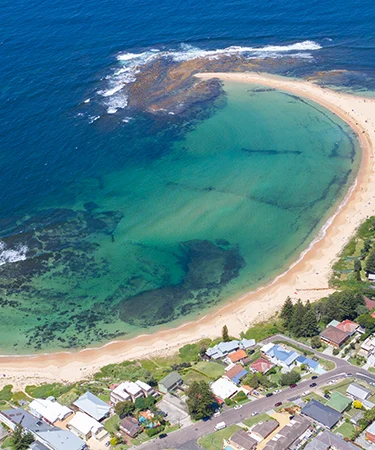 large beachstrip bay with camper park located right on the coast